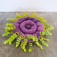 Marrin Lee Martinez: "See Anemone" soft sculpture. A series of quilted purple concentric circles with bright green "tentacles" emanating from the perimeter