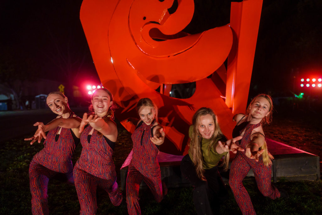 Dancers and choreographer Maartje pose in front of "Mamma Mobius"