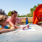 A mother and son work on an art project at SLOMA's Second Saturdays event