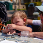 A mother and child work on an art project at SLOMA's Second Saturdays event