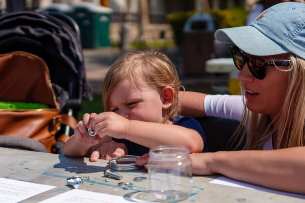 A mother and child work on an art project at SLOMA's Second Saturdays event