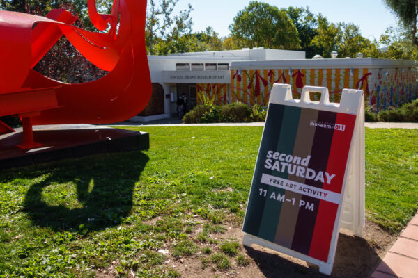 SLOMA's Second Saturdays signage next to our lawn area with the Museum in the background