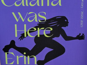 Cover for Calafia was Here catalog. Deep purple background with yellow-green text and a black running figure