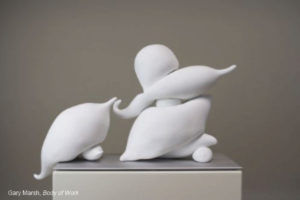 Two white, cloud-like figures seemingly dance a tango