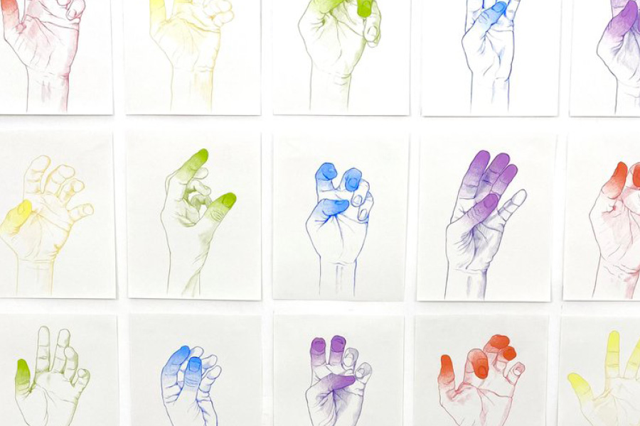 3x5 grid of papers with multicolored drawings of hands in different shapes