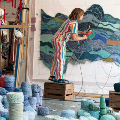 Artist Trish Andersen tufting a custom textile piece