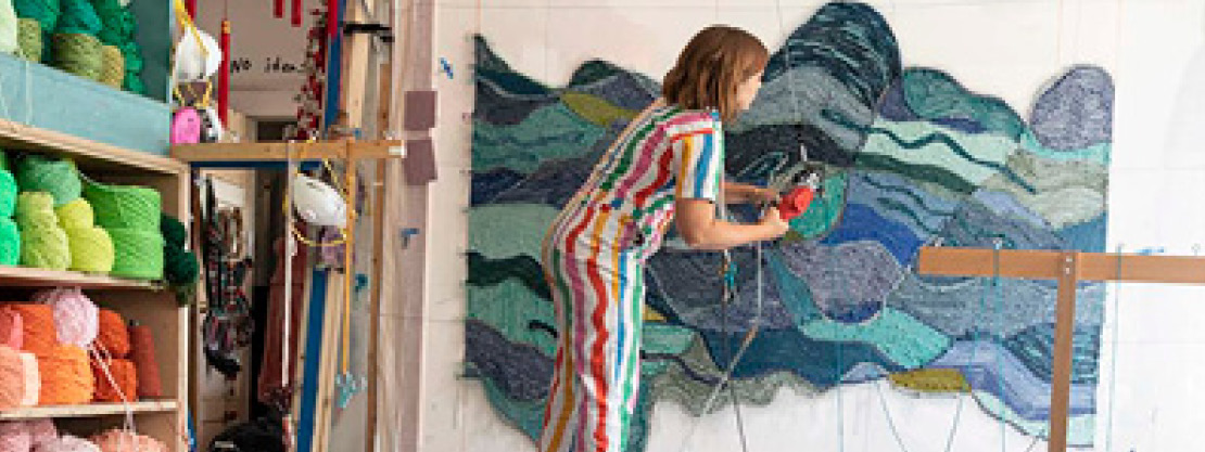 Trish Andersen Artist Trish Andersen tufting a custom textile piece