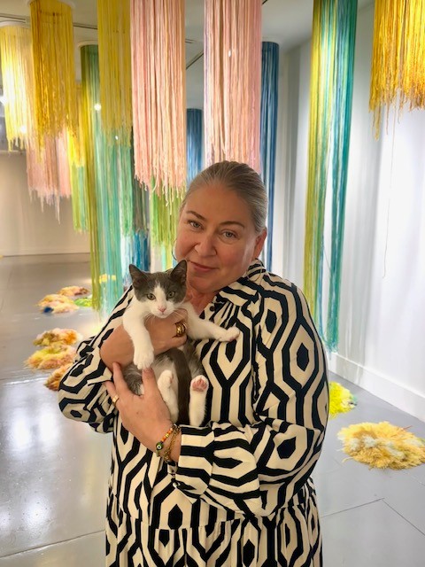 Leann with a kitten SLOMA's Director holding an adorable kitten in the gallery