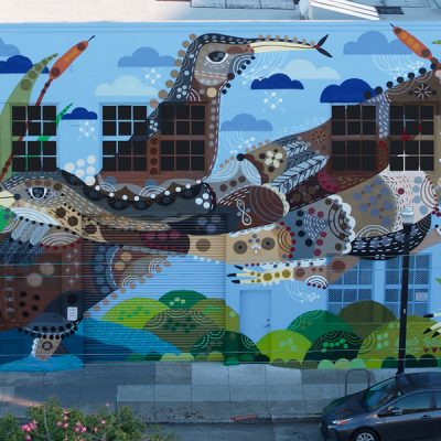 Reiss temp banner A colorful mural on a two-story building depicting aquatic birds