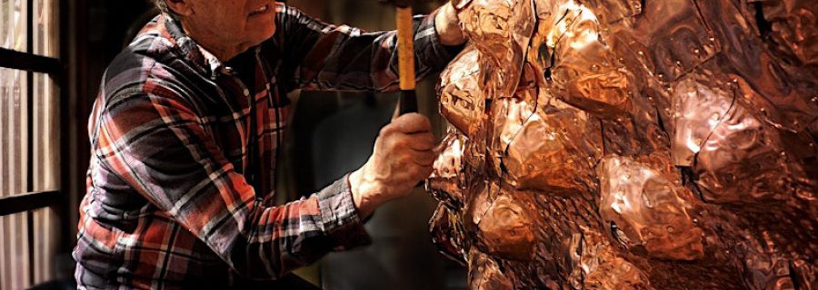 Artist Bruce Johnson working in his studio